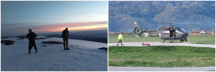 2 mensen staan in de sneeuw op een berg en een helikopter landt om onderkoelde klimmers af te voeren voor medisch onderzoek.