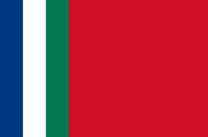 Foto van de Molukse vlag met links drie smalle verticale banen in de kleuren blauw, wit en groen en daarnaast uiterst rechts een groot, verticaal rood vlak.