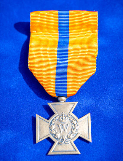 Close up van het Bronzen Kruis.