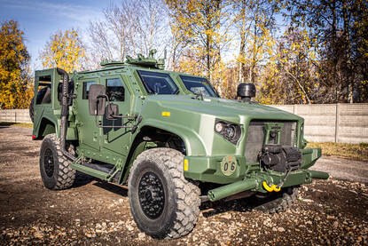 Het groene Kaaiman-wielvoertuig